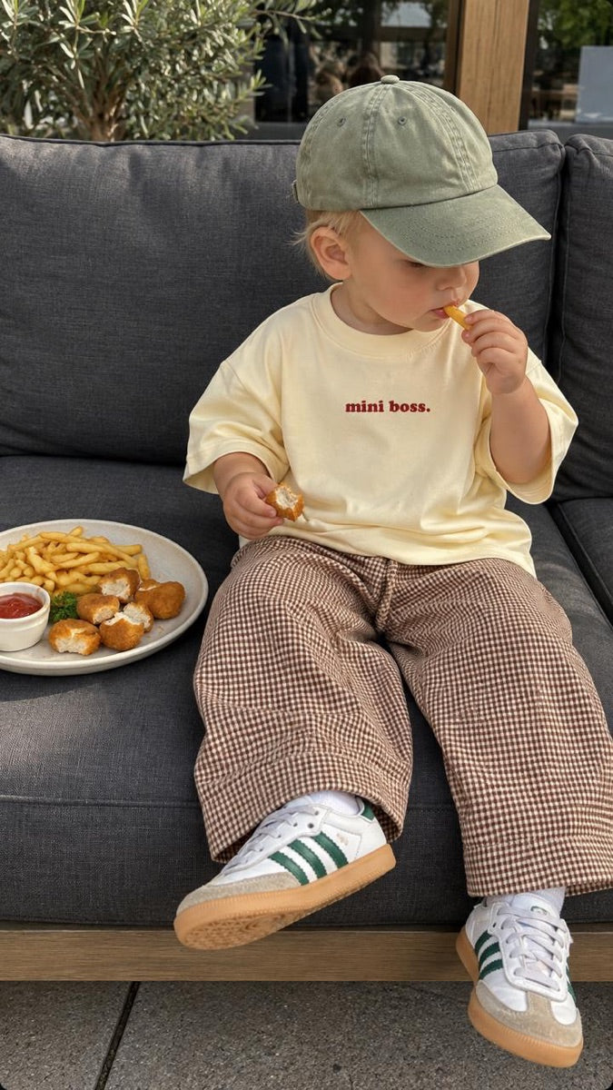 Child wearing a Mini Boss T-shirt